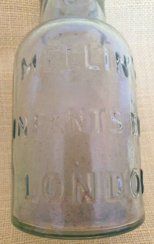 2 x Antique embossed bottles