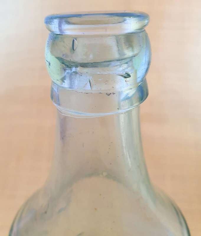 2 x Antique embossed bottles
