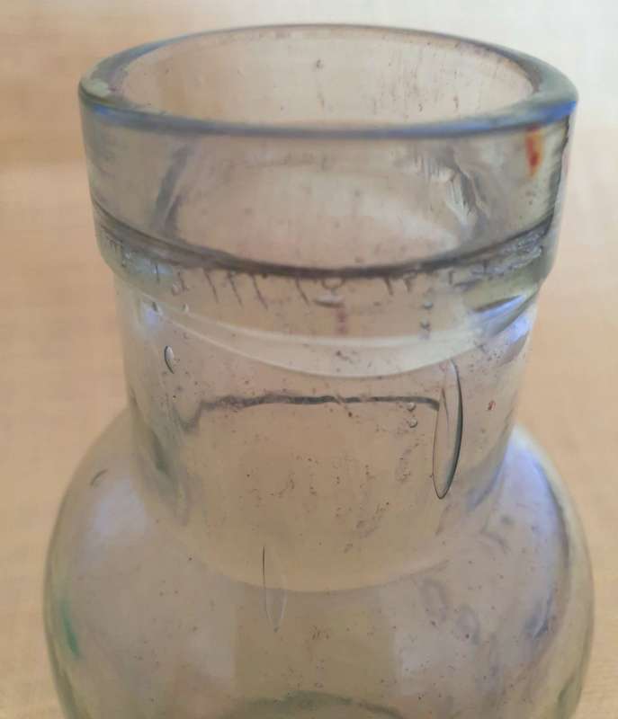 2 x Antique embossed bottles