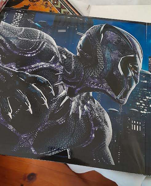 Black Panther Big Sleeve Edition and contains Exclusive 12"Art Cards