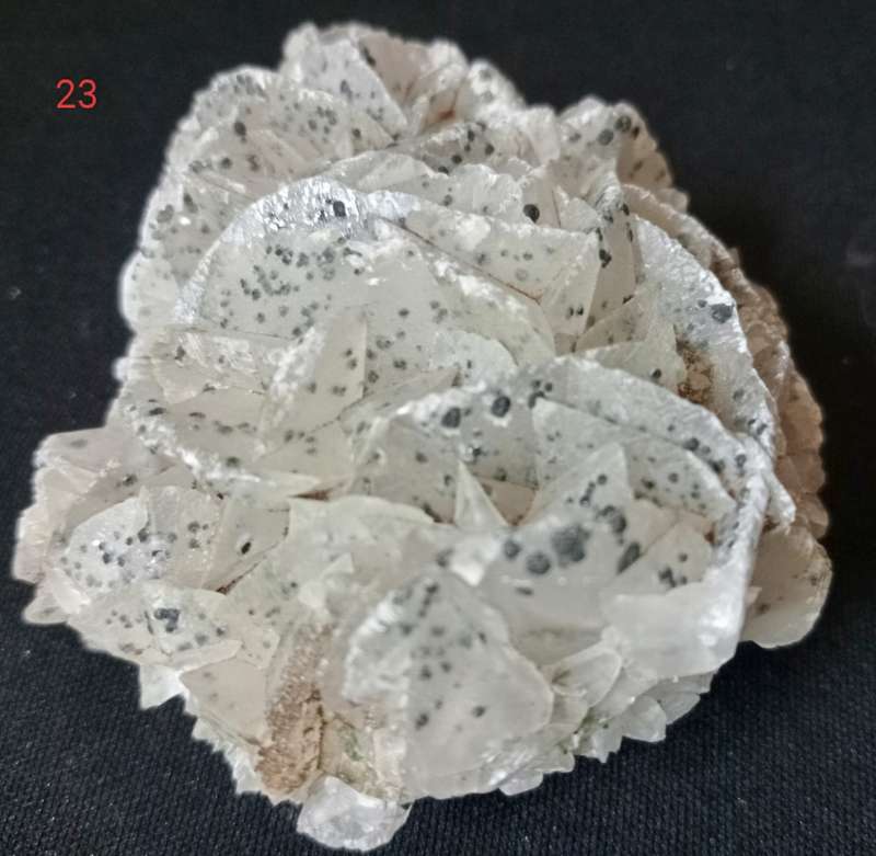 Calcite flower on quartz/green epidote and goethite inclusions