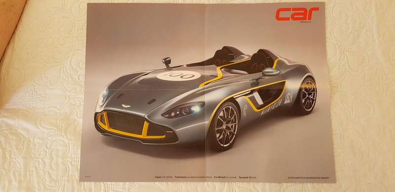 EIGHT LARGE MOTORCAR POSTERS OF POPULAR SPORTS CARS OF RECENT YEARS.