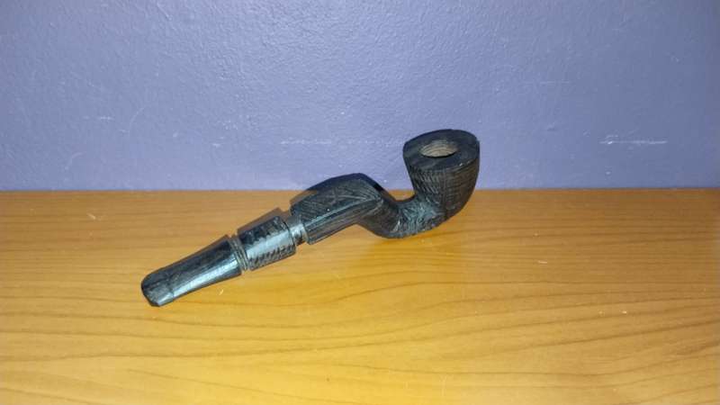 Beautiful wooden pipe, hand carved in Mozambique.