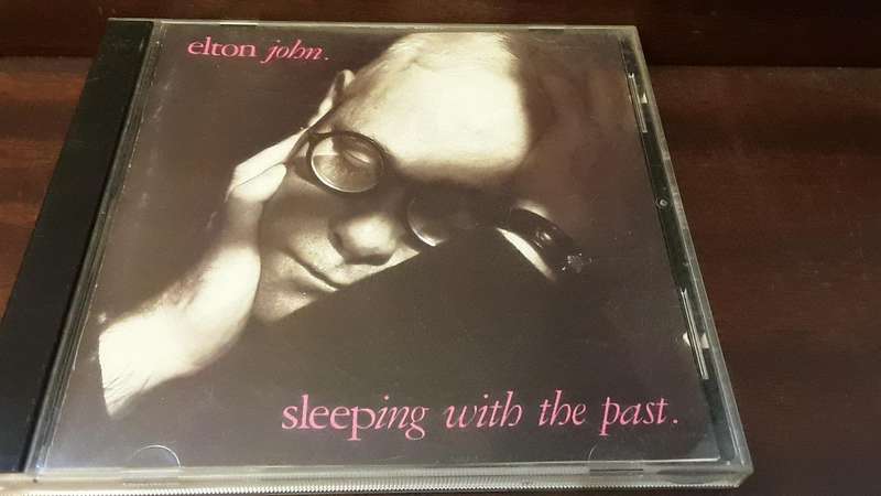 CD music  :  Elton John , sleeping with the past
