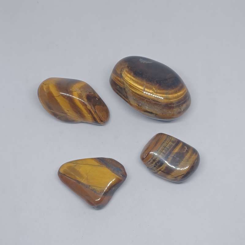 4 Tigers eye Tumble stones (total weight - 132.9g)
