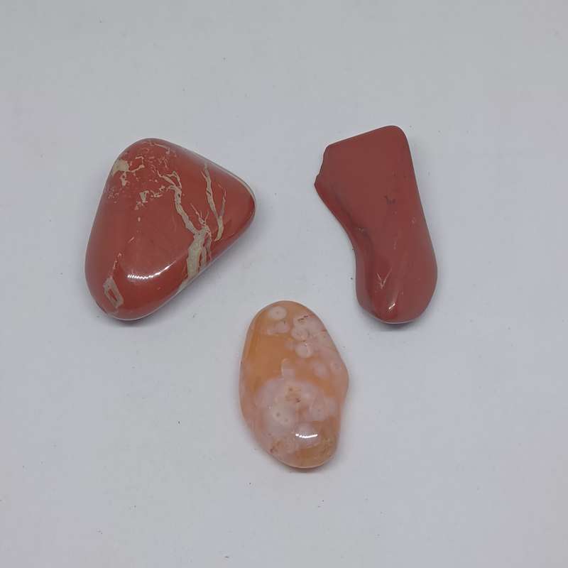2 x red jasper tumble stones (total weight - 52.5g) and 1  x flower plume agate (weight - 13.8g)