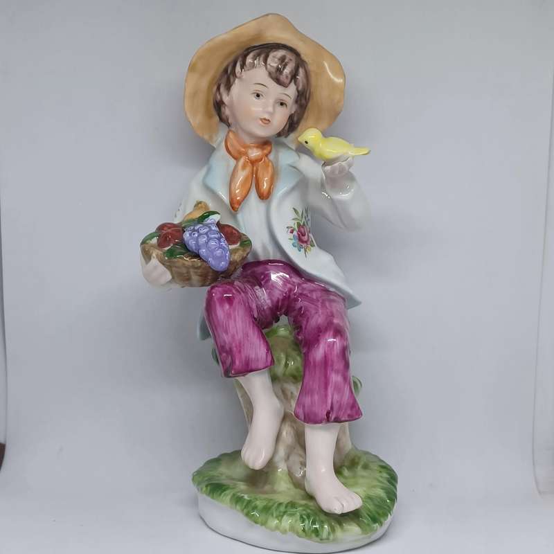 Vintage Porcelain Figurine Country Boy With Basket Of Fruit and Bird (18cm x 8cm)