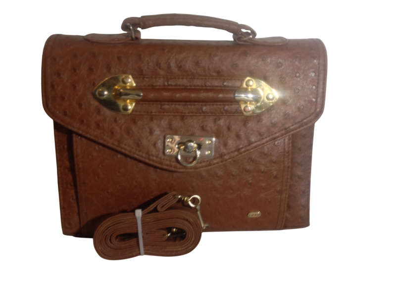 Elevate your accessory game with this exquisite brown leather vintage treasure