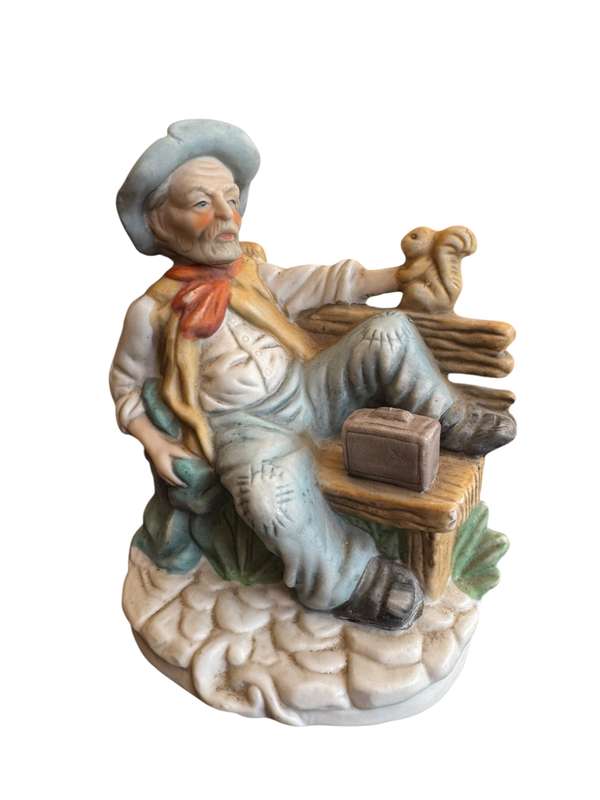 Old man on bench ornament