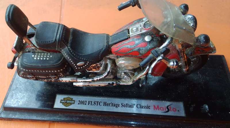 vintage Harley bike on stand.