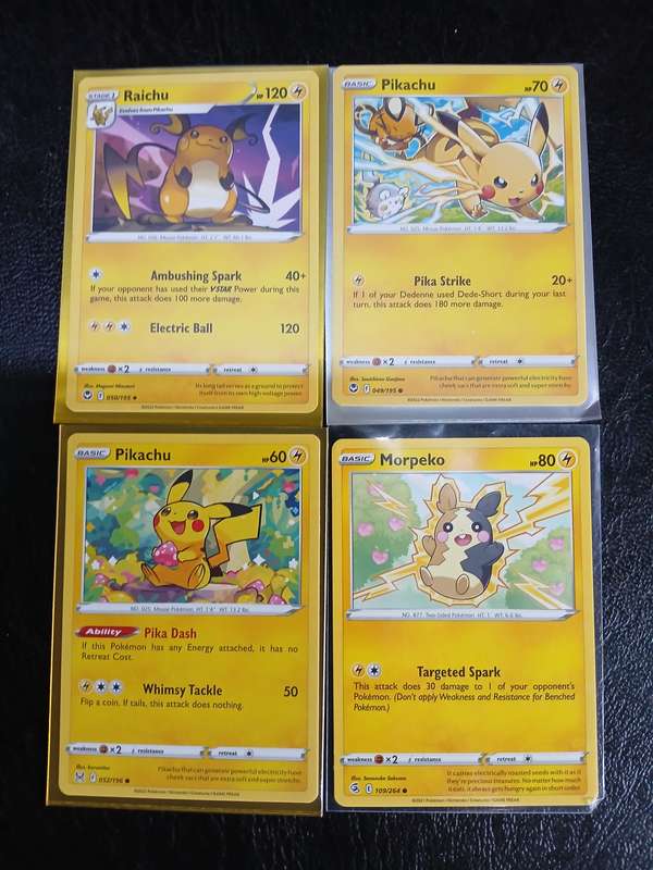 Pokémon Trading Cards featuring Pikachu, Raichu, and Morpeko + Flying Pikachu V  Gold Foil