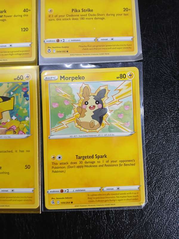 Pokémon Trading Cards featuring Pikachu, Raichu, and Morpeko + Flying Pikachu V  Gold Foil