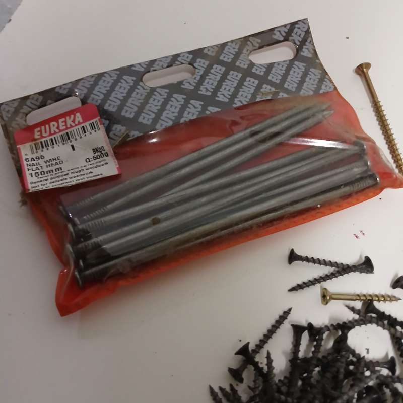 assortment of fasteners, primarily screws and nails