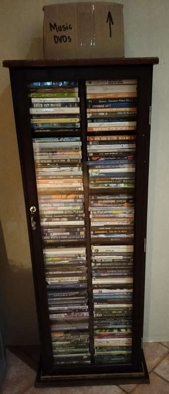 168 Music DVDs and wood/glass lockable cabinet