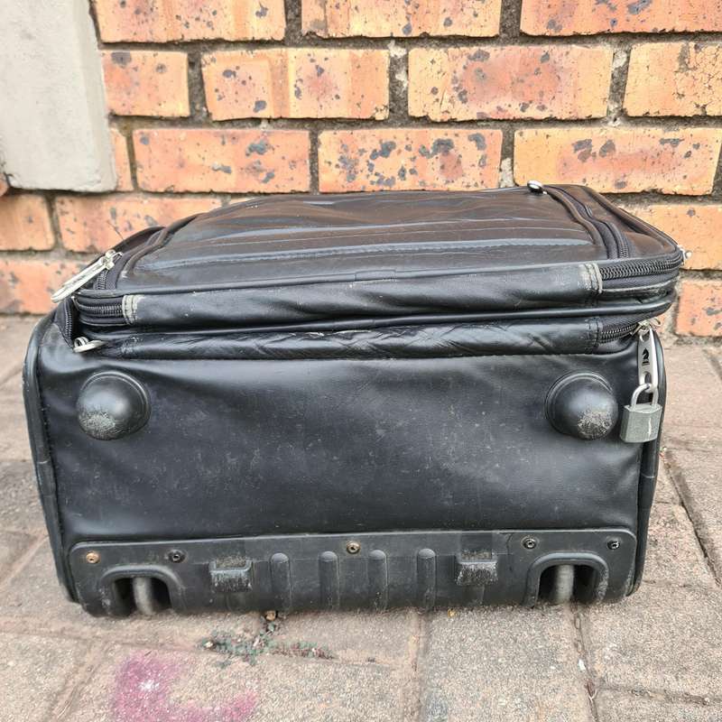 Ricardo Leather Carry-On Travel Bag with Rollers