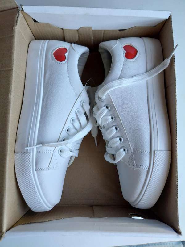 White Sneakers with Red Heart Design.