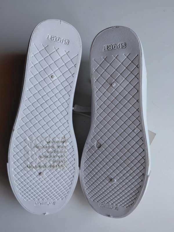 White Sneakers with Red Heart Design.