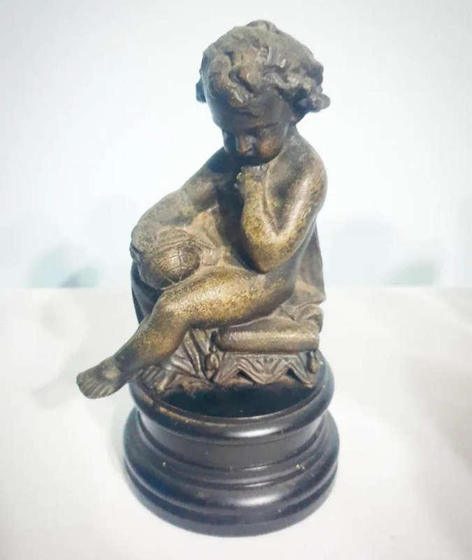 Vintage spelter figurine of a young boy in the style of Falconet