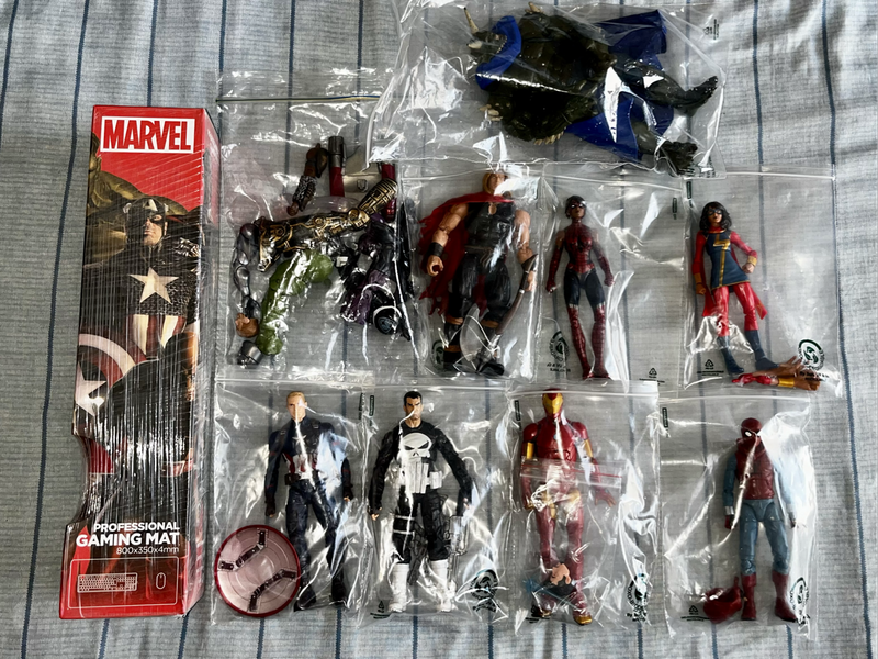 8 Marvel legends Figure by Hasbro for sale and a marvel Gaming Mat