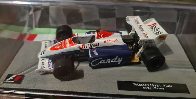 a 1/43 scale model of the Toleman TG184 Formula 1 car, driven by Ayrton Senna in 1984.