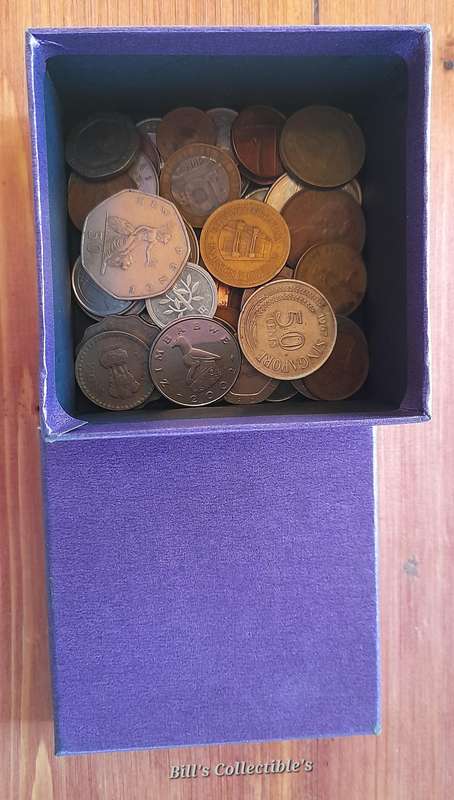 50 International Coins . Box included.