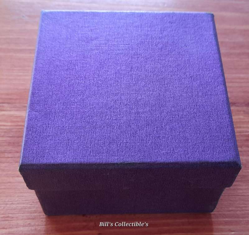 50 International Coins . Box included.