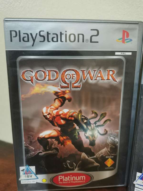 God of War 1 and 2 on PlayStation 2 with booklets