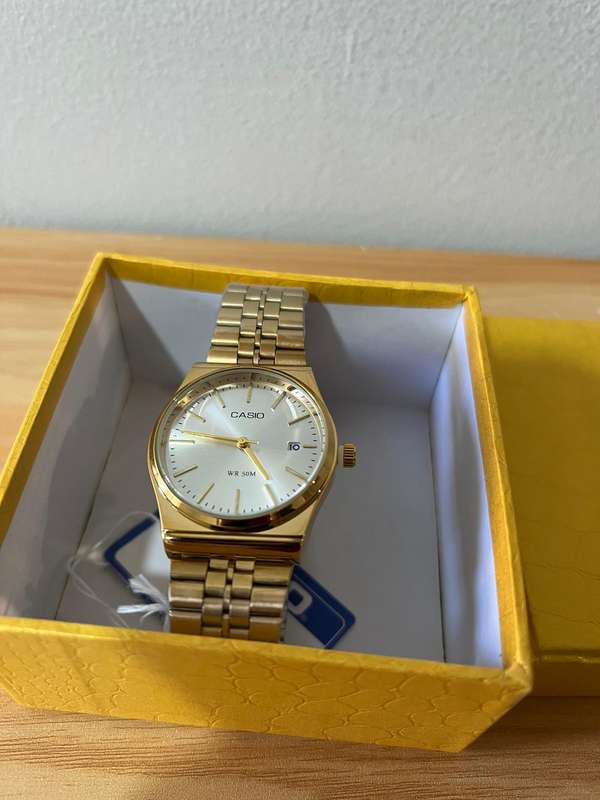 Casio MTP analog gold-tone wristwatch.