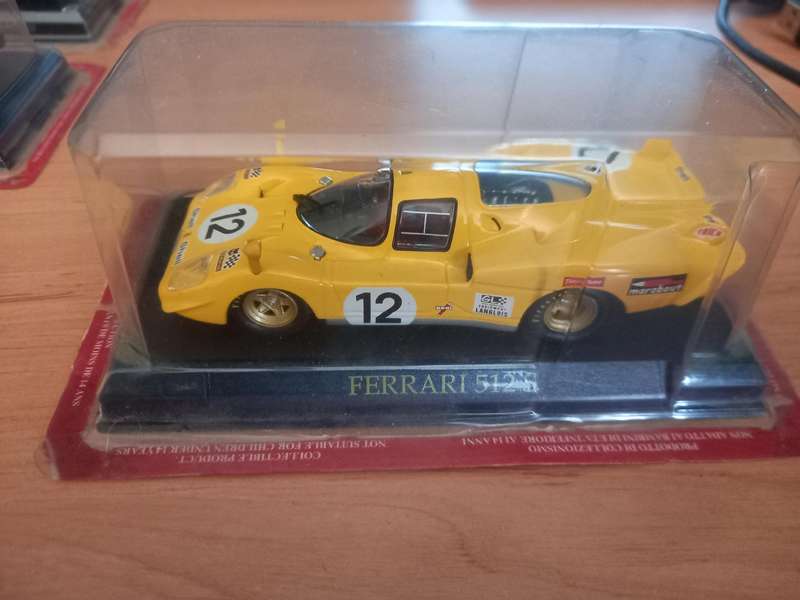 14 Ferrari die cast model cars + their magazines