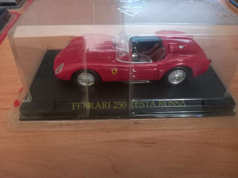 14 Ferrari die cast model cars + their magazines