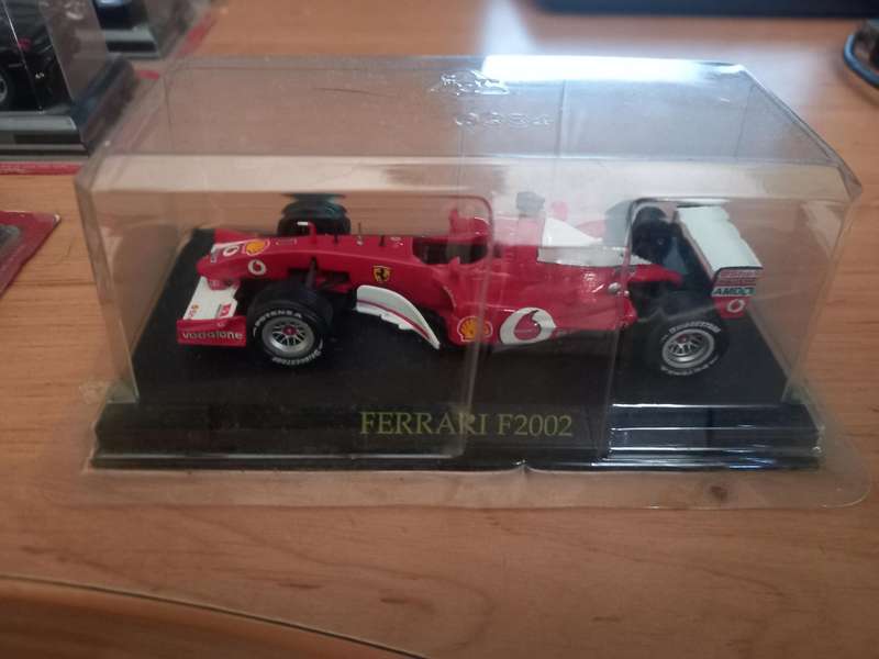 14 Ferrari die cast model cars + their magazines