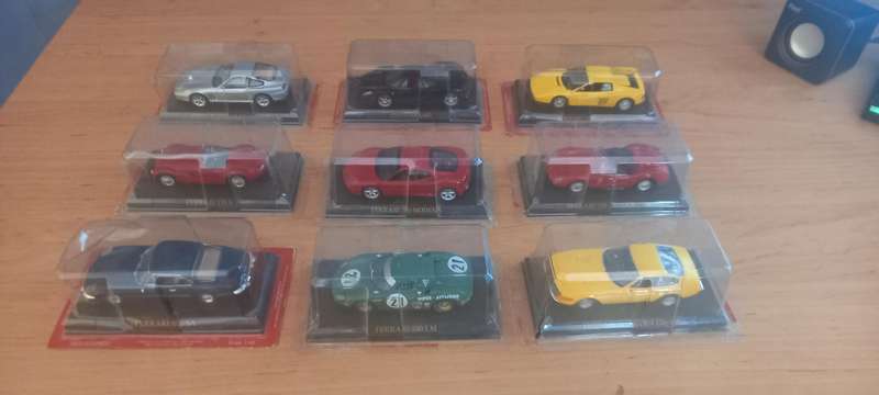 9 Ferrari die cast model cars + their magazines