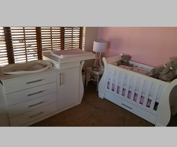 Nursery Baby cot and compactum with bath area