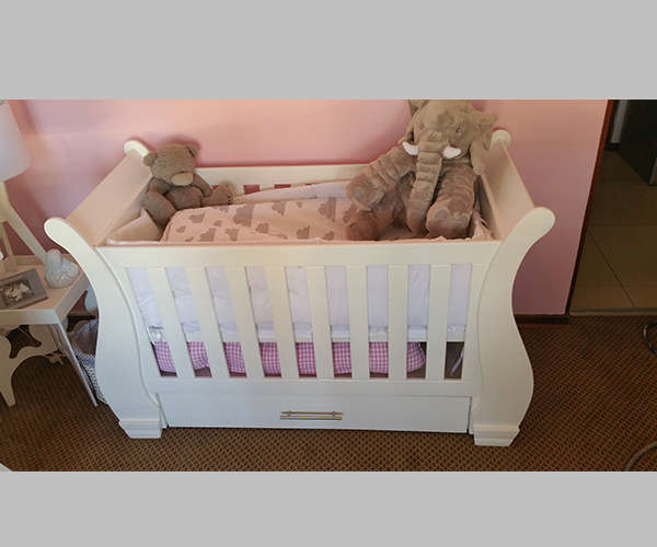 Nursery Baby cot and compactum with bath area