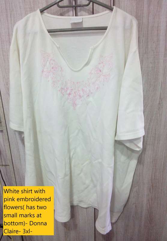 white shirt with pink design- has stains