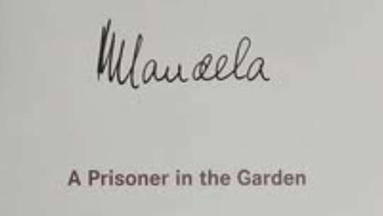 Nelson Mandela signed book - A prisoner in the Garden