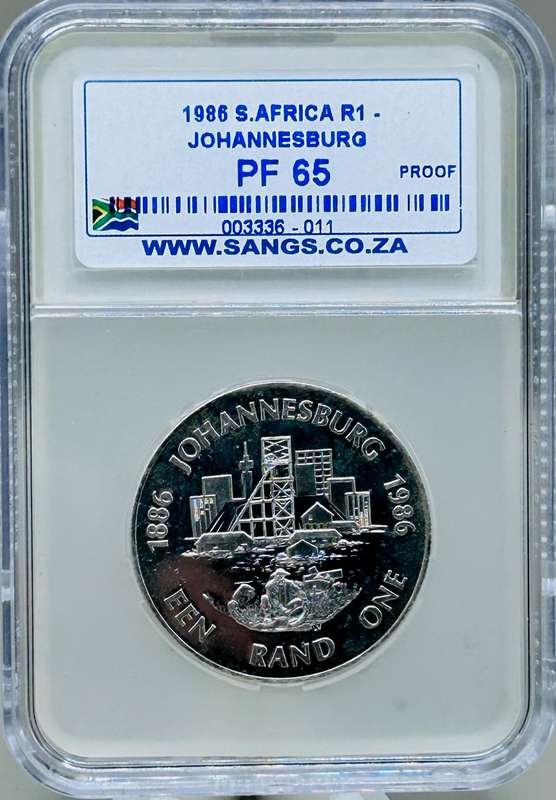 1986 ONE RAND, JOHANNESBURG ANNIVESARY SILVER GRADED PROOF, PF 65 COIN
