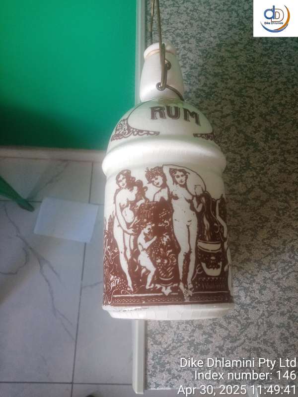Vintage stoneware "RUM" crock specifically identified as East India Rum crock