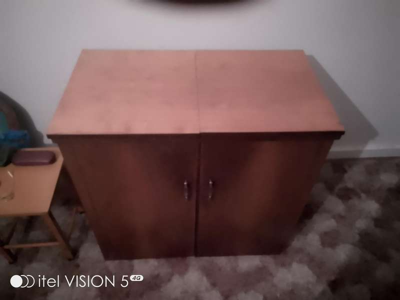 Sewing machine with built in cubord