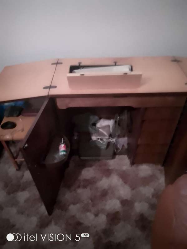 Sewing machine with built in cubord