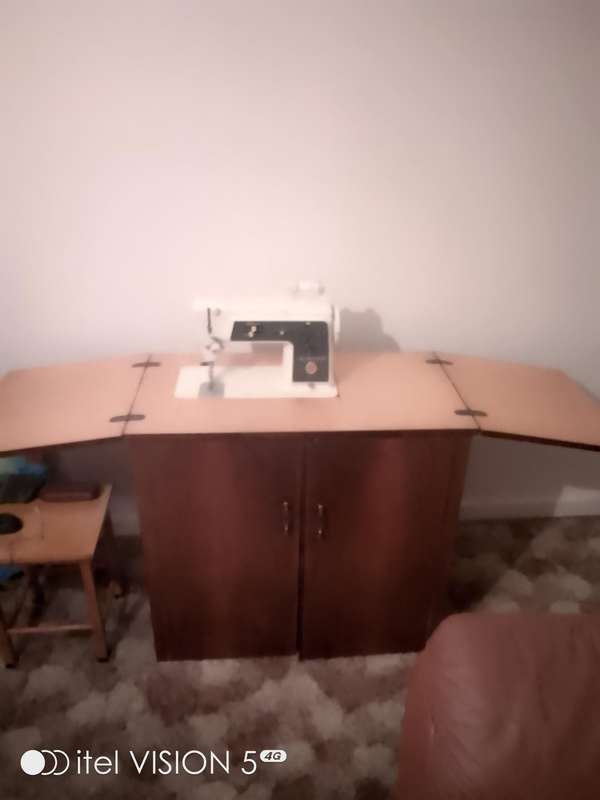 Sewing machine with built in cubord