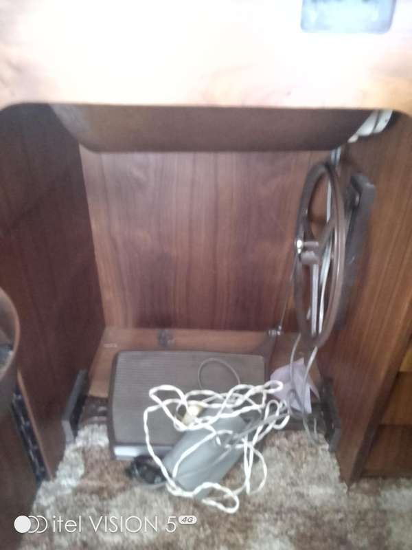 Sewing machine with built in cubord