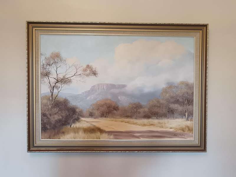 Thomas Hacking (South Africa, 1932 - ), Bushveld Road with Clouded Mountain, oil on canvas