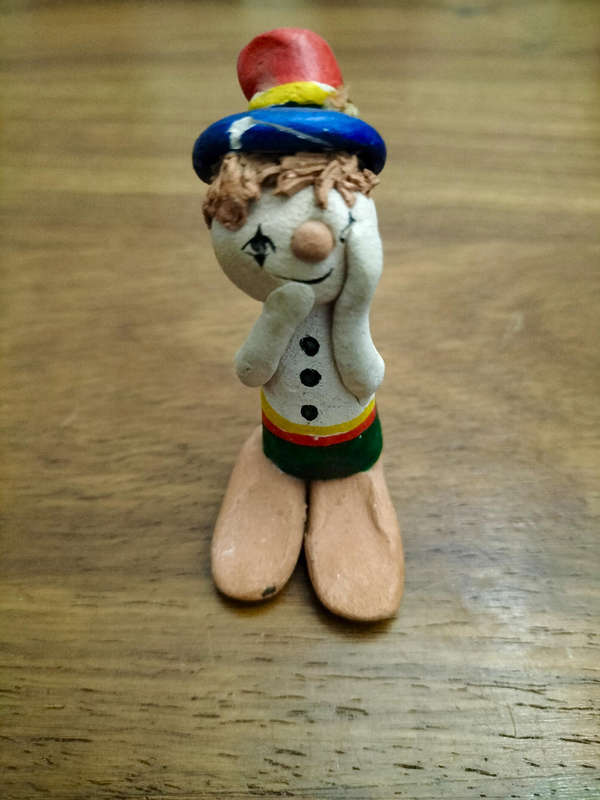Vintage pottery clown figurine