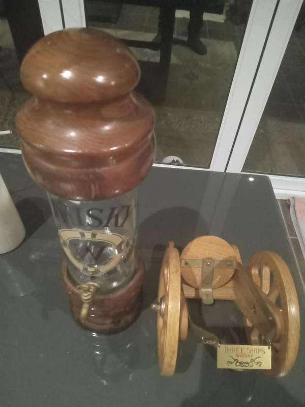 ANTIQUE WHISKEY DISPENSER AND THREE SHIPS WHISKEY BOTTLE CANON HOLDER
