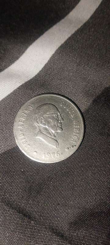 1976 20c coin maculant condition