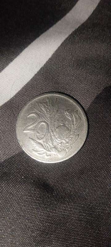1976 20c coin maculant condition