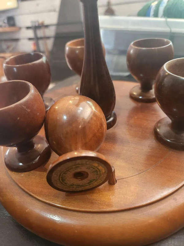 Wooden egg cups with holder. All pins intact