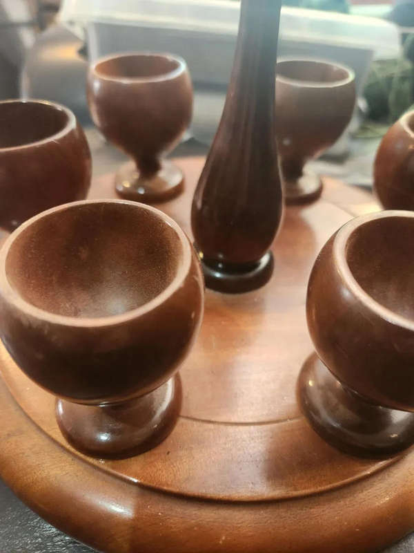 Wooden egg cups with holder. All pins intact