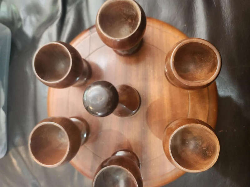 Wooden egg cups with holder. All pins intact